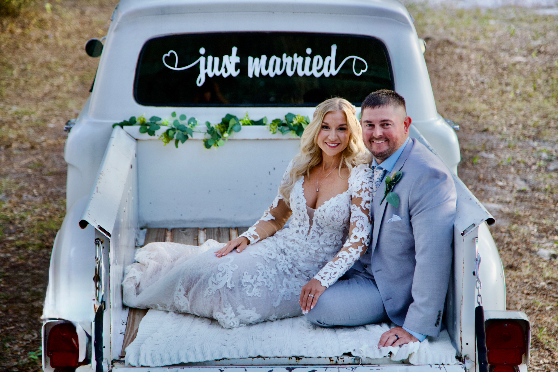 Just married couple in vintage white pickup truck — Central Florida wedding by Frost Films